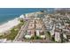Condo complex with a shared pool, offering stunning views of the beach at 6700 Sunset Way # 303, St Pete Beach, FL 33706