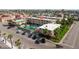Aerial view of condominium complex with parking, swimming pool, and beach access at 6700 Sunset Way # 303, St Pete Beach, FL 33706