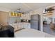 Kitchen featuring vintage cabinets, breakfast nook and modern stainless steel appliances at 6700 Sunset Way # 303, St Pete Beach, FL 33706