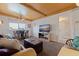 Living room featuring nautical decor, including a ceiling fan and water view at 6700 Sunset Way # 303, St Pete Beach, FL 33706
