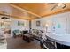 Living room with ceiling fan, TV, nautical decor, seating, and small dining area at 6700 Sunset Way # 303, St Pete Beach, FL 33706