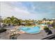 Enjoy a refreshing swim in the inviting community pool surrounded by lush landscaping and lounge chairs at 6700 Sunset Way # 303, St Pete Beach, FL 33706