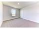 Cozy carpeted bedroom with a view of a peaceful pond at 6807 162Nd Pl, Parrish, FL 34219