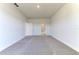 Spacious carpeted bedroom with a doorway to an en-suite bathroom at 6807 162Nd Pl, Parrish, FL 34219