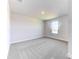 Bright bedroom featuring neutral carpet, white walls, and a window that offers plenty of natural light at 6807 162Nd Pl, Parrish, FL 34219
