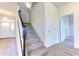 Welcoming entryway with carpeted staircase and modern flooring at 6807 162Nd Pl, Parrish, FL 34219