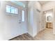 Inviting entryway showcasing wood-look tile flooring and a stylish powder room, creating a welcoming ambiance at 6807 162Nd Pl, Parrish, FL 34219