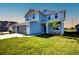 Inviting two-story home showcasing lush green grass, gray siding, and an attached two-car garage at 6807 162Nd Pl, Parrish, FL 34219
