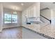The eat-in kitchen features granite countertops, stainless steel appliances, and a large window at 6807 162Nd Pl, Parrish, FL 34219
