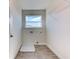Functional laundry room with tile floors, utility sink, washer/dryer hookups, and a window for ventilation at 6807 162Nd Pl, Parrish, FL 34219