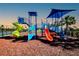 Fun, colorful community playground with slides, climbing structures, and a soft rubber surface for safety at 6807 162Nd Pl, Parrish, FL 34219
