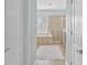 Bright bathroom showcasing a bathtub, and a glass door shower, all enhanced by natural light at 7710 S Desoto St, Tampa, FL 33616