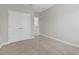 Bedroom with carpet, closet, and doorway, creating a peaceful and functional space at 7710 S Desoto St, Tampa, FL 33616