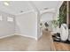 Bright foyer with tile floors, neutral walls, and an open floor plan at 7710 S Desoto St, Tampa, FL 33616