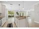 A spacious kitchen island with stainless steel appliances and plenty of room for cooking at 7710 S Desoto St, Tampa, FL 33616