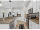 Spacious kitchen with granite countertops, stainless steel appliances, and ample counter space at 7710 S Desoto St, Tampa, FL 33616