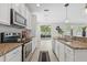 A modern kitchen with granite countertops and stainless steel appliances at 7710 S Desoto St, Tampa, FL 33616