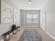 Cozy upstairs loft featuring neutral carpeting, natural light and modern decor at 7710 S Desoto St, Tampa, FL 33616