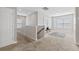 Upstairs loft with neutral carpeting, natural light and decorative accents at 7710 S Desoto St, Tampa, FL 33616