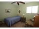Bedroom with a single bed, window, bedside table, and comfortable seating area at 8011 Peach Dr # 103, Tampa, FL 33637