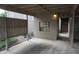 View of covered carport, showing the unit number and access to the front door at 8011 Peach Dr # 103, Tampa, FL 33637