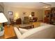 Comfortable living area featuring tile floors, neutral walls, and a cozy seating arrangement at 8011 Peach Dr # 103, Tampa, FL 33637