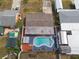 A bird's eye view shows a private pool with blue deck and well manicured yard at 8305 75Th Pl, Seminole, FL 33777