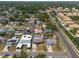 Aerial view of a residential neighborhood with a single-story home with a backyard pool at 8305 75Th Pl, Seminole, FL 33777