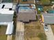 An aerial view shows a backyard oasis, featuring a pool and a well-maintained yard at 8305 75Th Pl, Seminole, FL 33777