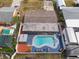 Charming aerial view of a backyard featuring a pool and cozy lounge area, perfect for summer relaxation at 8305 75Th Pl, Seminole, FL 33777