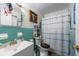 This bathroom features tile accents and a shower-tub combo at 8305 75Th Pl, Seminole, FL 33777