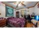 This bedroom is bright with a ceiling fan and natural light from a window at 8305 75Th Pl, Seminole, FL 33777