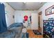 This cozy bedroom is well-lit with an overhead ceiling fan and natural light at 8305 75Th Pl, Seminole, FL 33777