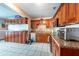 Well-lit kitchen featuring granite countertops, ample wooden cabinetry and modern stainless steel appliances at 8305 75Th Pl, Seminole, FL 33777