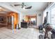 Open kitchen with stainless steel refrigerator, tile flooring, and glass patio doors at 8305 75Th Pl, Seminole, FL 33777