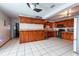 Bright kitchen with stainless steel appliances, granite countertops, and tile flooring at 8305 75Th Pl, Seminole, FL 33777