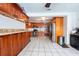 Spacious kitchen with stainless appliances, granite countertops, and tile flooring at 8305 75Th Pl, Seminole, FL 33777