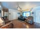 Bright living room featuring beautiful wood floors, comfortable seating and ample natural light at 8305 75Th Pl, Seminole, FL 33777