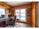 This wood-paneled room offers an view to the pool at 8305 75Th Pl, Seminole, FL 33777