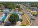 Lovely single-Gathering home in a tranquil neighborhood, showcasing a swimming pool and lush greenery at 8413 Lopez Dr, Tampa, FL 33615