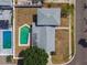Single-Gathering home with a gray roof, showcasing a private swimming pool, and fenced-in backyard at 8413 Lopez Dr, Tampa, FL 33615