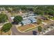 An elevated view featuring a two-story home nestled in a lush, residential neighborhood at 8413 Lopez Dr, Tampa, FL 33615