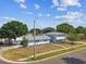 A beautiful two-story home in a tranquil neighborhood setting with mature trees at 8413 Lopez Dr, Tampa, FL 33615