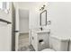 This well-lit bathroom features modern fixtures, unique floor tiles, and a sleek vanity at 8413 Lopez Dr, Tampa, FL 33615