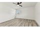 Bright bedroom features a modern ceiling fan, and durable, attractive wood-look flooring at 8413 Lopez Dr, Tampa, FL 33615