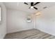 Bright bedroom featuring wood-look floors, white walls, and a contemporary ceiling fan at 8413 Lopez Dr, Tampa, FL 33615