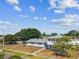 An attractive two-story home with manicured landscaping and mature shade trees at 8413 Lopez Dr, Tampa, FL 33615