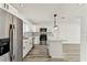Modern kitchen features stainless appliances, white cabinets, and center island at 8413 Lopez Dr, Tampa, FL 33615