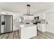 Bright eat-in kitchen features stainless appliances and modern finishes at 8413 Lopez Dr, Tampa, FL 33615