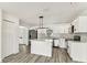 A modern eat-in kitchen features stainless appliances and center island at 8413 Lopez Dr, Tampa, FL 33615